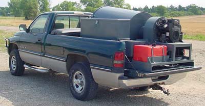 Large Commercial Vacumn Setting In Back Of Pickup